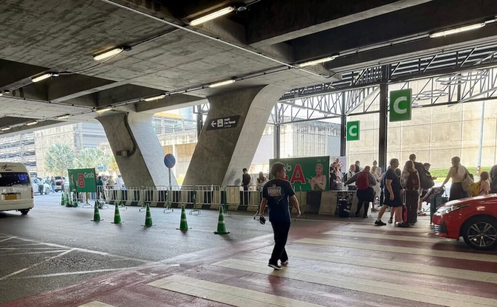 Bangkok Airport Grab Ride pick-up point - look for the green Grab signs